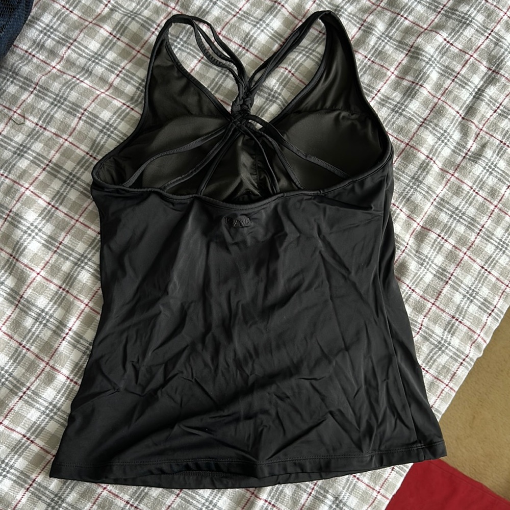 Used- bought off poshmark but have never swam in it-